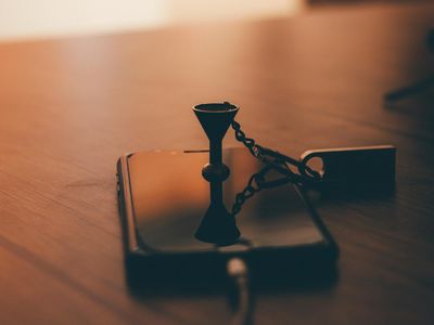 A simple hourglass on a wooden table.