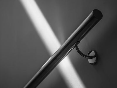 Abstract light patterns on a white wall.